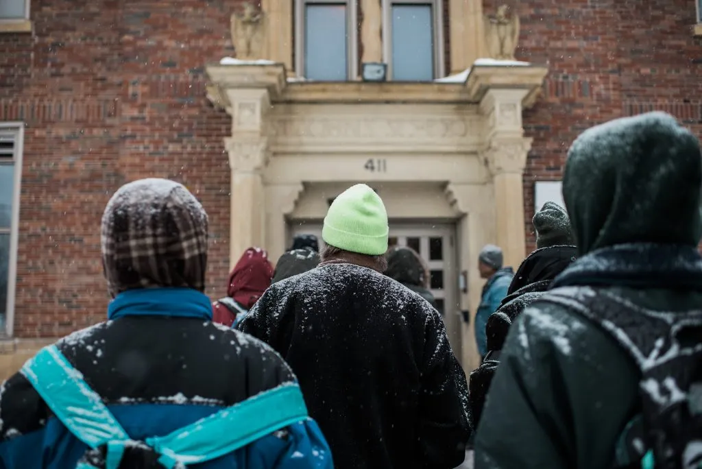 Men walking into the shelter
