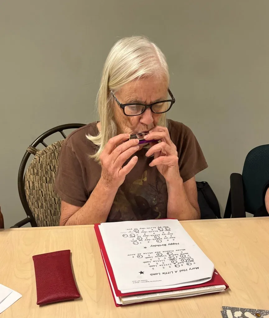 Sue Playing Harmonica