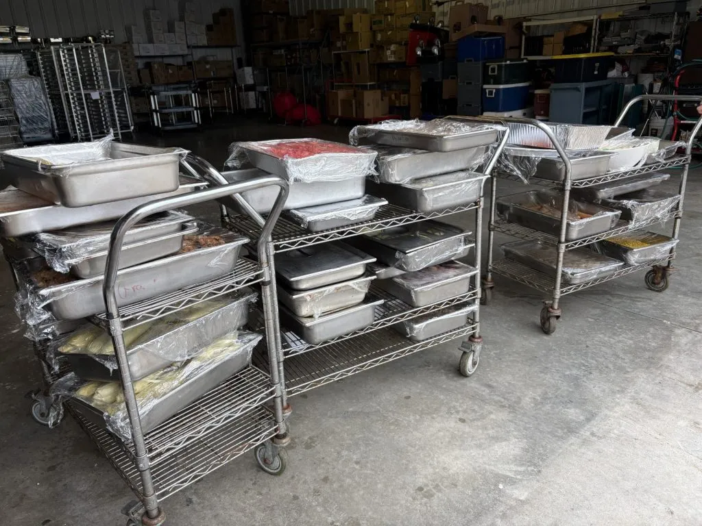 carts with large metal containers of food