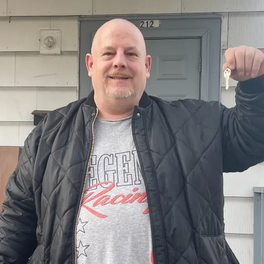 man holding set of keys