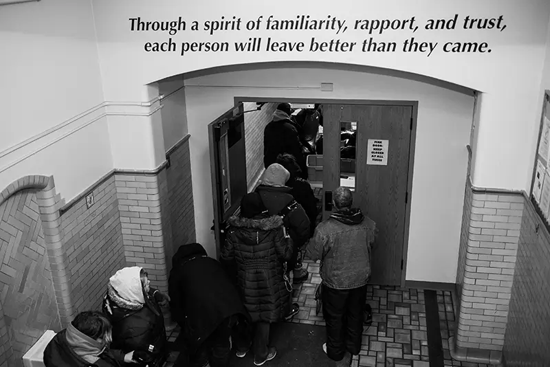 photo of guests at shelter walking into indoor entrance