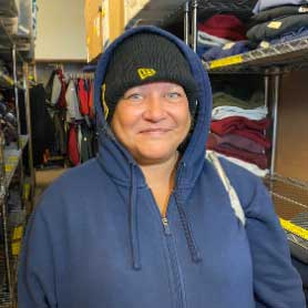 woman with hat on smiling