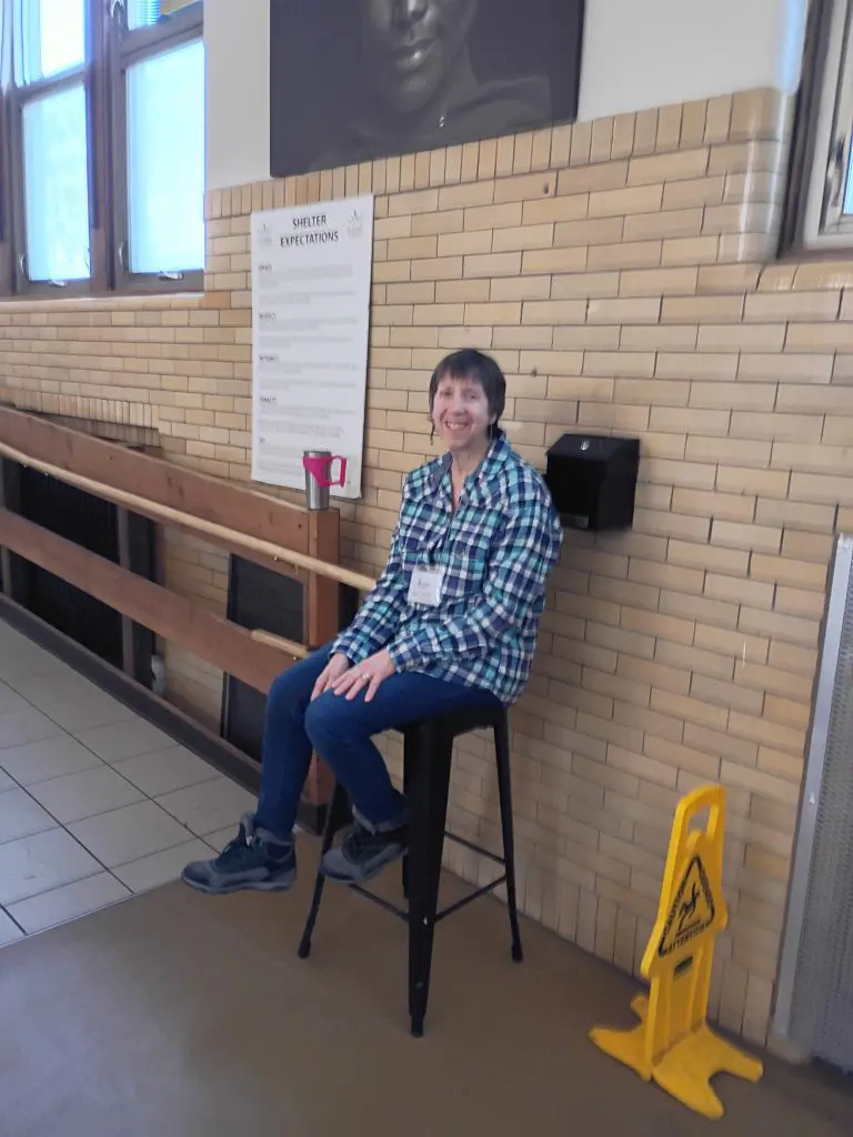 woman sitting on stool