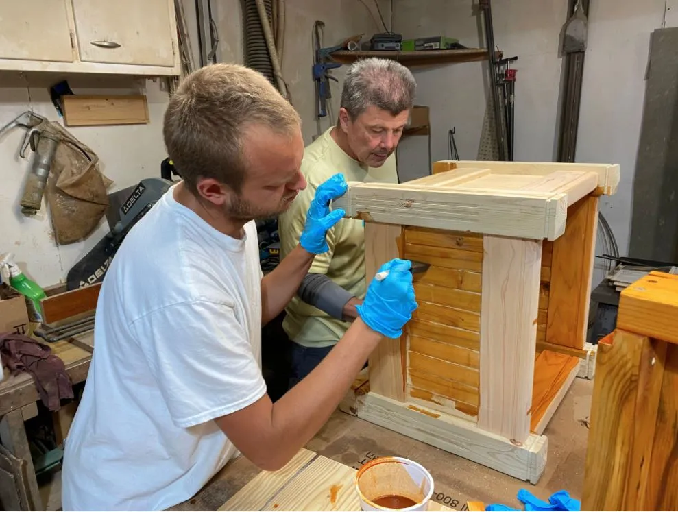 Men working on wooden project