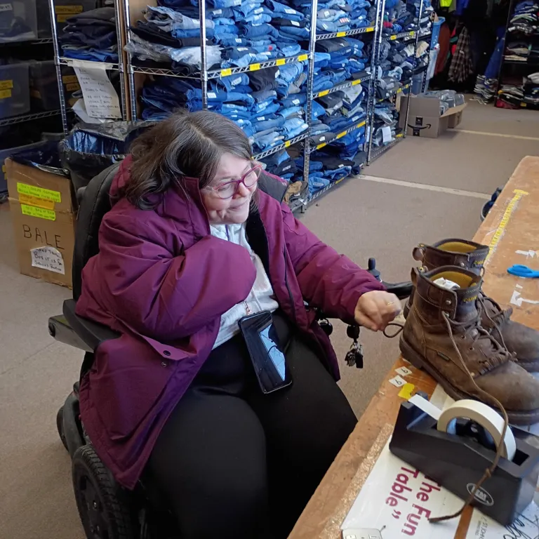 Cindy volunteer in St. John's Ministries' donation room
